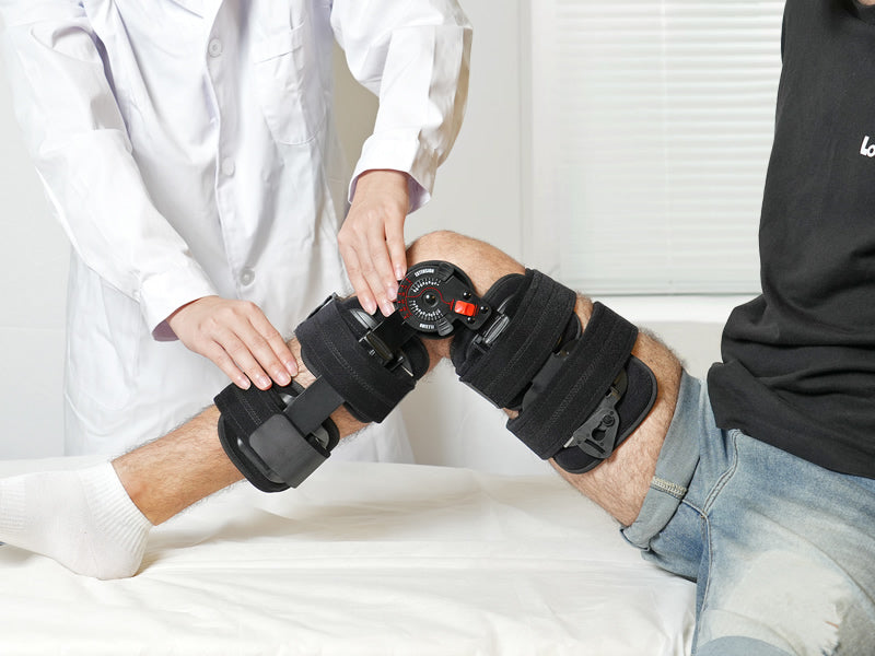 The_man_was_lying_in_bed_wearing_a_lock_brace